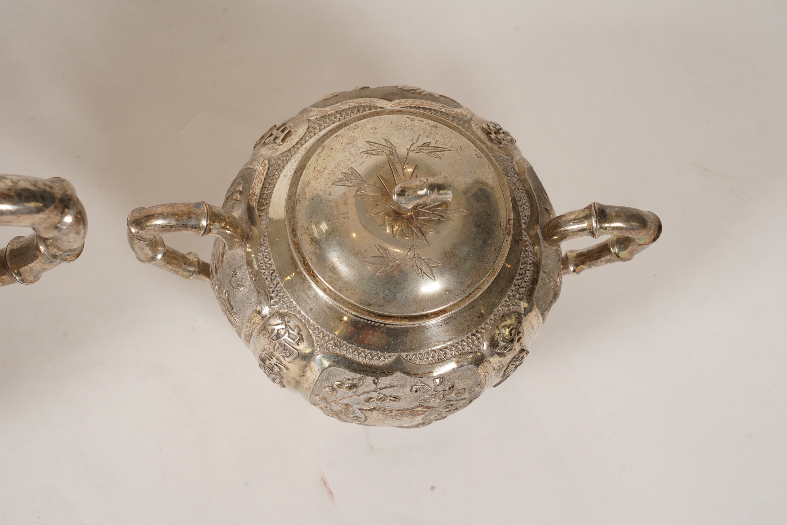 A late 19th/early 20th century Chinese Export white metal three-piece tea set, maker's mark WA